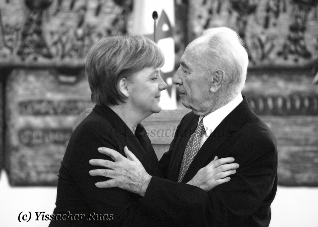 IMG_2753 German Chancellor Angela Merckel and Israeli President Shimon Peres sharing a moment
