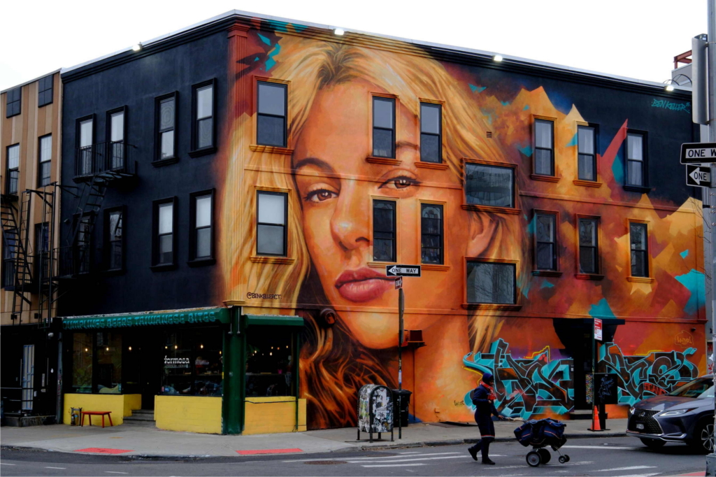 A giant mural by artist Ben Keller depicting slain Ukrainian migrant Iryna Zaurutska is pictured on a building at the corner of Evergreen Avenue and Jefferson Street in the Bushwick section of Brooklyn, photographed Friday, January 16, 2026. Zaurutska emigrated from Ukraine before she was brutally stabbed to death in Charlotte, North Carolina, in a killing that sparked outrage and renewed concerns over violent crime and the safety of women. The large-scale artwork now looming over the Brooklyn street serves as a stark memorial to her life.