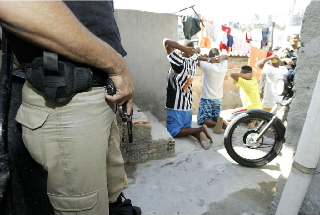Brazilian military police squad round-up suspects and search for drugs in the Alto da Serra shantytown in Belo Horizonte, Brazil. The Military Police units, which have their own formations, rules and uniforms depending on the state, are responsible for maintaining public order across the country. Deployed solely to act as a deterrent against the commission of a crime, units do not conduct criminal investigations.