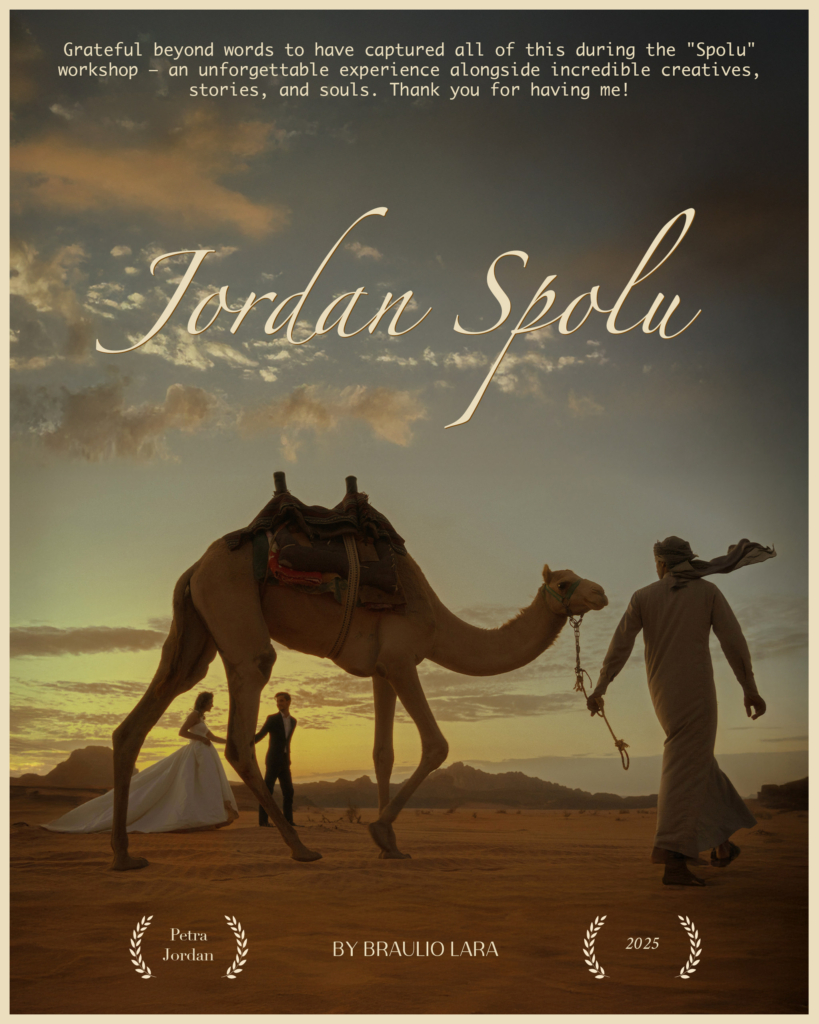 A cinematic desert scene at sunset shows a camel being led across golden sand by a man in traditional clothing. In the background, a bride and groom walk together, their silhouettes framed by warm evening light.

The image appears as a film-style poster titled “Jordan Spolu” by photographer Braulio Lara, evoking a romantic story set in the vast landscape of Petra, Jordan.