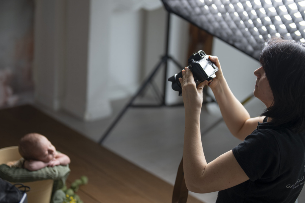 Gabriella Fardella - wife of David  Photographer capturing tender family moments in a softly lit studio setting.