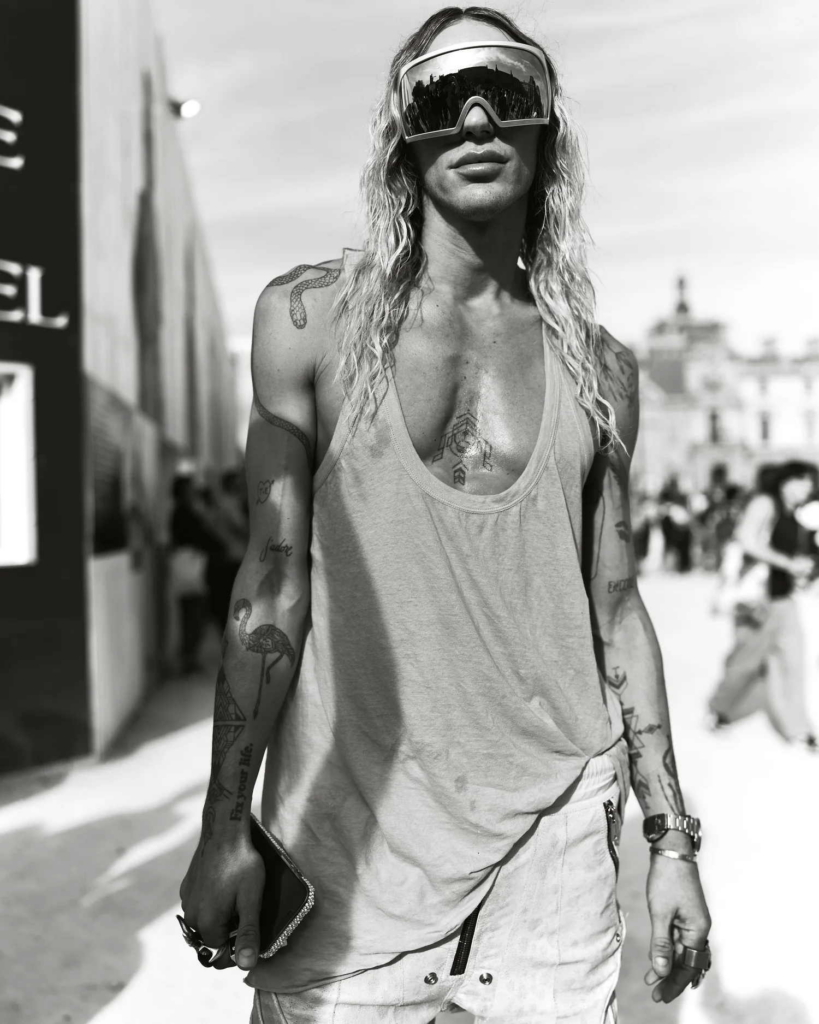 A pair of striking black-and-white street style portraits that capture individuality, attitude, and fashion as self-expression. The raw urban setting, strong poses, and natural light give the images an effortless editorial feel, while each subject brings a distinct visual identity that makes the frame feel both personal and cinematic.