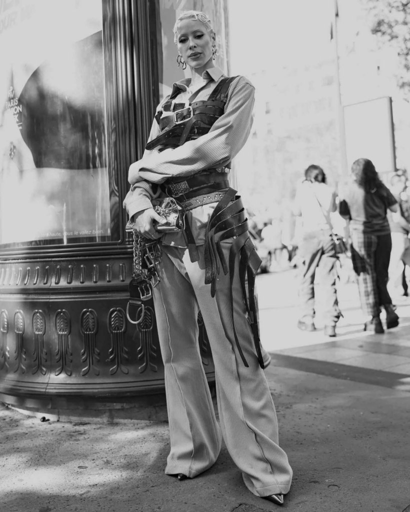 A pair of striking black-and-white street style portraits that capture individuality, attitude, and fashion as self-expression. The raw urban setting, strong poses, and natural light give the images an effortless editorial feel, while each subject brings a distinct visual identity that makes the frame feel both personal and cinematic.