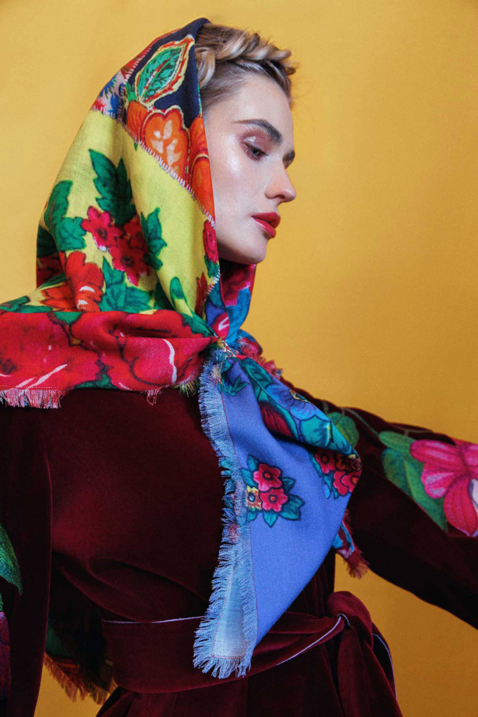 Fashion portrait with vibrant floral scarf styling and bold cinematic color contrast.