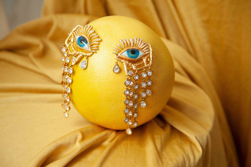 Surreal still life with jeweled eyes transforming citrus into an emotional portrait.